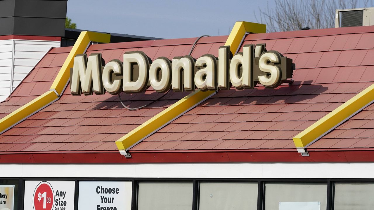 A sign is displayed over a McDonald's restaurant in Des Moines, Iowa. (AP Photo/Charlie Neibergall)