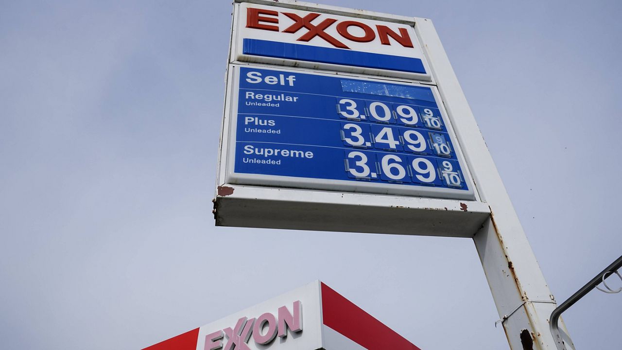 Gas prices are shown on a Exxon service station sign in Philadelphia, Wednesday, April 28, 2021. Commodities like plastic, paper, sugar and grains are all getting more expensive as demand outpaces supply. Companies are also paying more for shipping as fuel costs rise and ports experience longer delays because of congestion. (AP Photo/Matt Rourke)