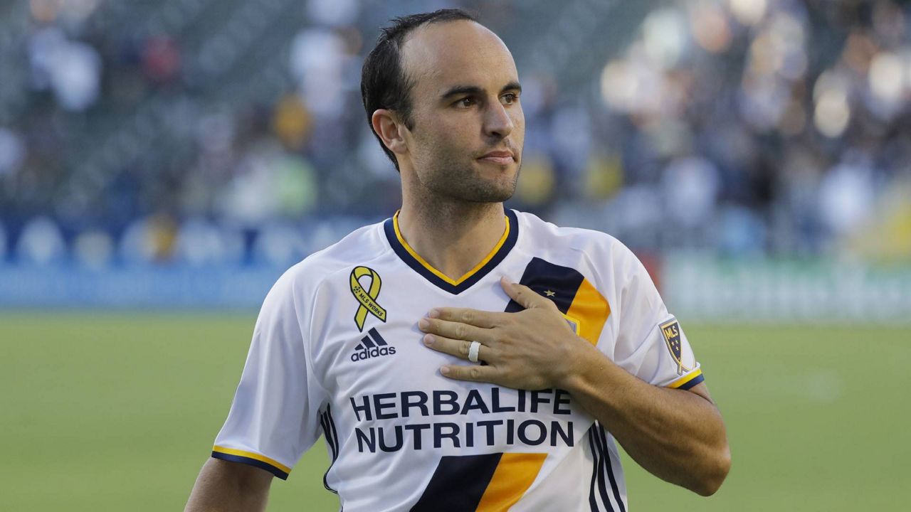 In this Sept. 11, 2016, file photo, Los Angeles Galaxy's Landon Donovan acknowledges fans after the team's MLS soccer match against Orlando City in Carson, Calif. (AP Photo/Jae C. Hong)