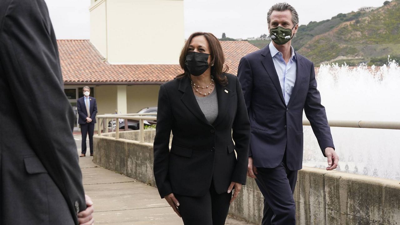 In this April 5, 2021 file photo, Vice President Kamala Harris, left, and California Gov. Gavin Newsom visit the Upper San Leandro Water Treatment Plant in Oakland, Calif. (AP Photo/Jacquelyn Martin)