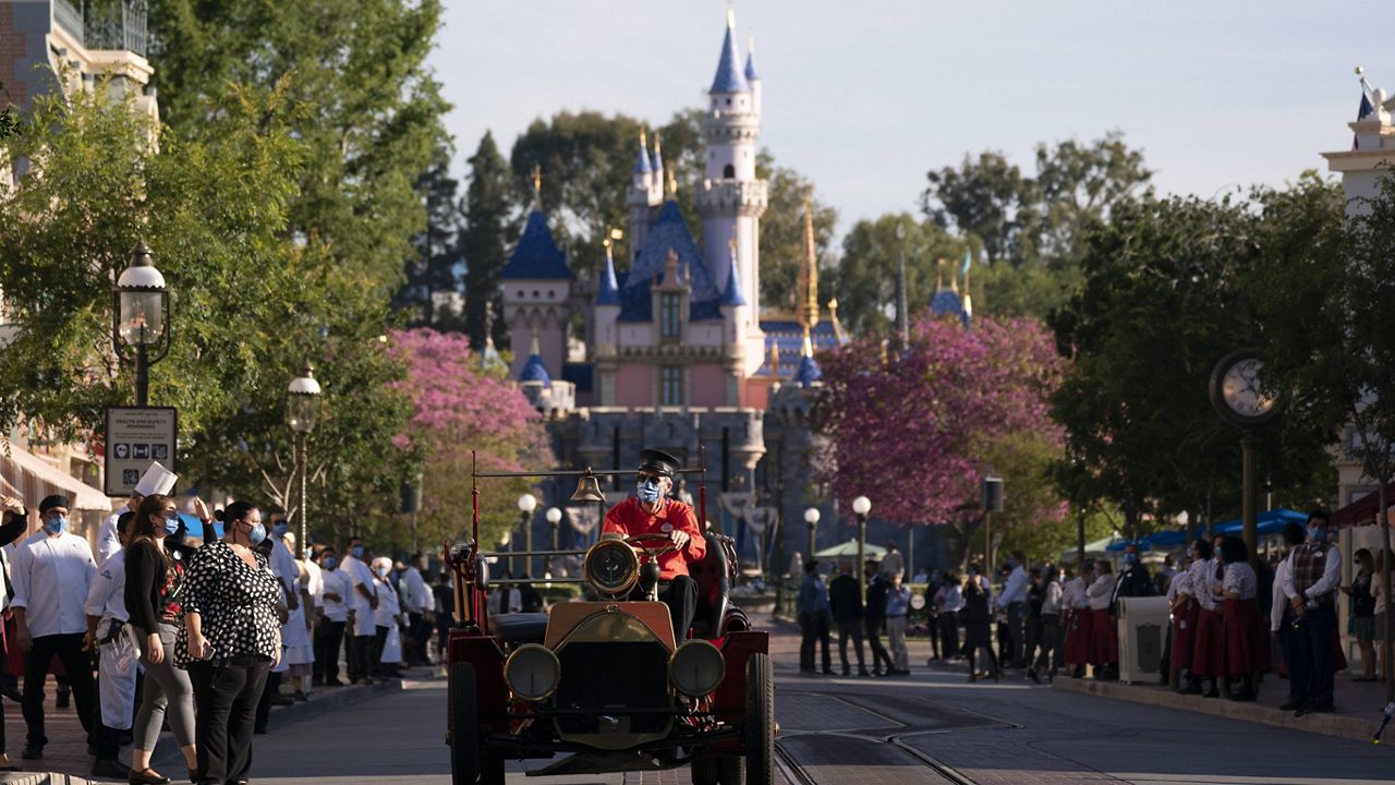The Fire Engine drives along the Main Street USA at Disneyland in Anaheim, Calif., Friday, April 30, 2021. (AP Photo/Jae C. Hong)