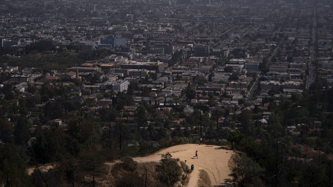 A jogger runs along a Griffith Park trail in Los Angeles, May 3, 2021. (AP Photo/Jae C. Hong)