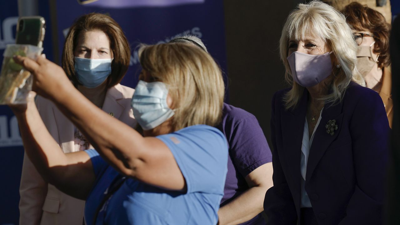 First lady Jill Biden poses for a photo as she attends a "National Nurses Day" event hosted by the Service Employees International Union (SEIU) at University Medical Hospital, in Las Vegas, Thursday, May 6, 2021. (Carlos Barria/Pool via AP)