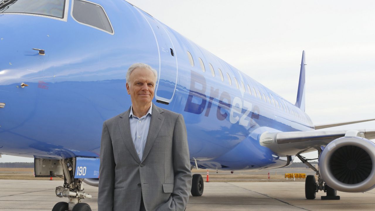 FILE - This file photo provided by CeanOrrett shows David Neeleman with Breeze aircraft. (CeanOrrett via AP, File)