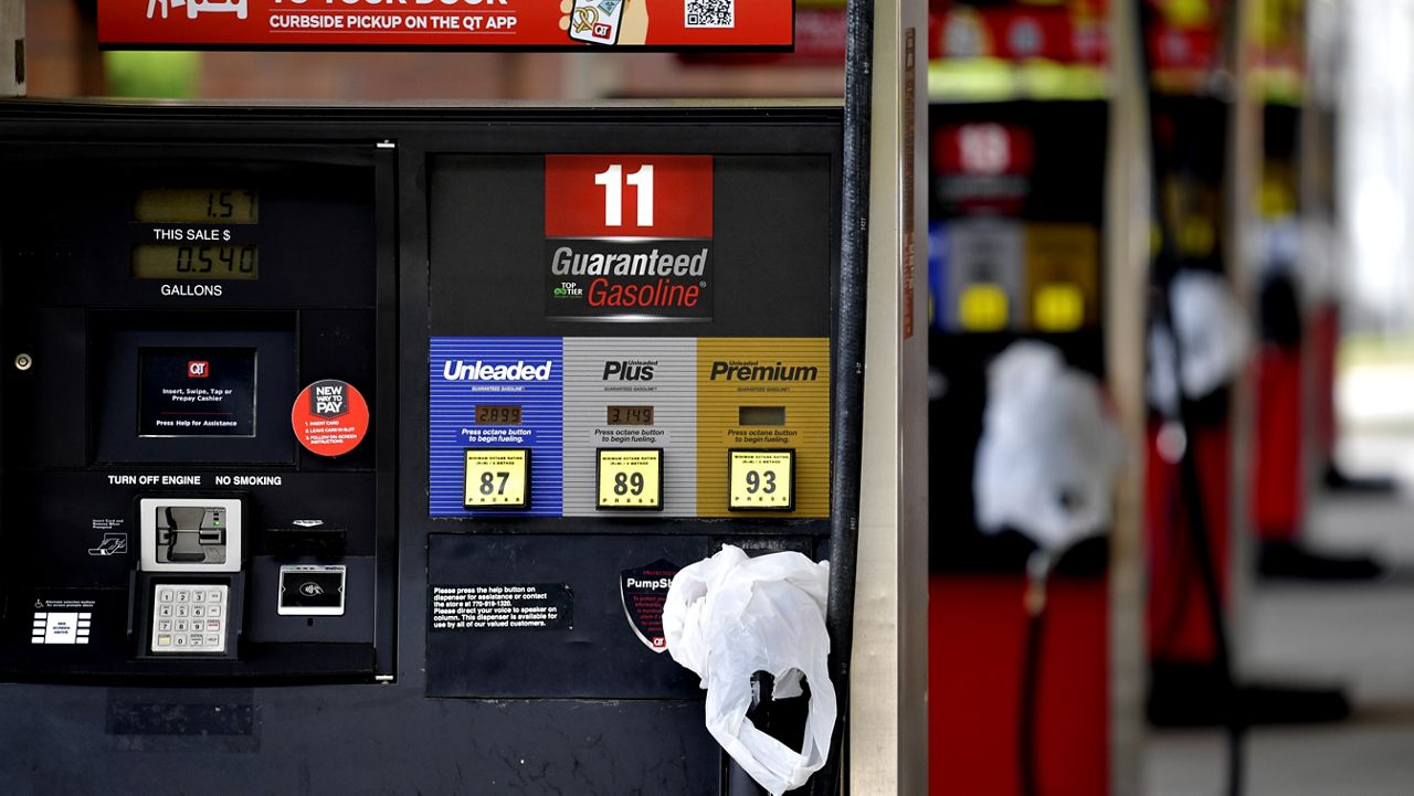 A QuickTrip connivence store has bags on their pumps as the station has no gas, Tuesday, May 11, 2021, in Kennesaw, Ga. Colonial Pipeline, which delivers about 45% of the fuel consumed on the East Coast, halted operations last week after revealing a cyberattack that it said had affected some of its systems. (AP Photo/Mike Stewart)