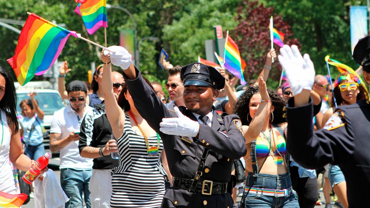 NYPD police officers march along Fifth Avenue during the gay pride parade in New York. 