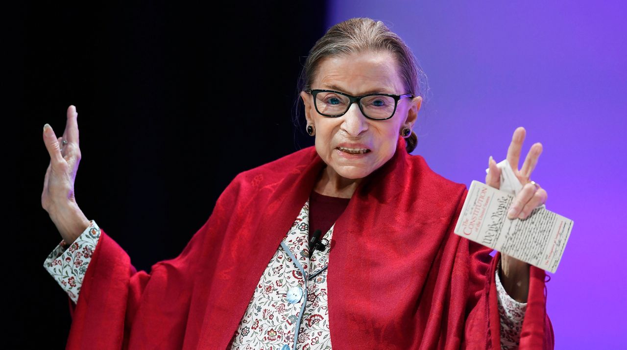In this Oct. 3, 2019 file photo, U.S. Supreme Court Justice Ruth Bader Ginsburg gestures to students before she speaks at Amherst College in Amherst, Mass. In her last years on the Supreme Court, Justice Ruth Bader Ginsburg moved slowly. She was always the last justice to exit the courtroom, with Justice Clarence Thomas helping her down the steps from the Supreme Court bench. But Ginsburg, who died in September at age 87, was known for her speed at something: writing opinions. (AP Photo/Jessica Hill)