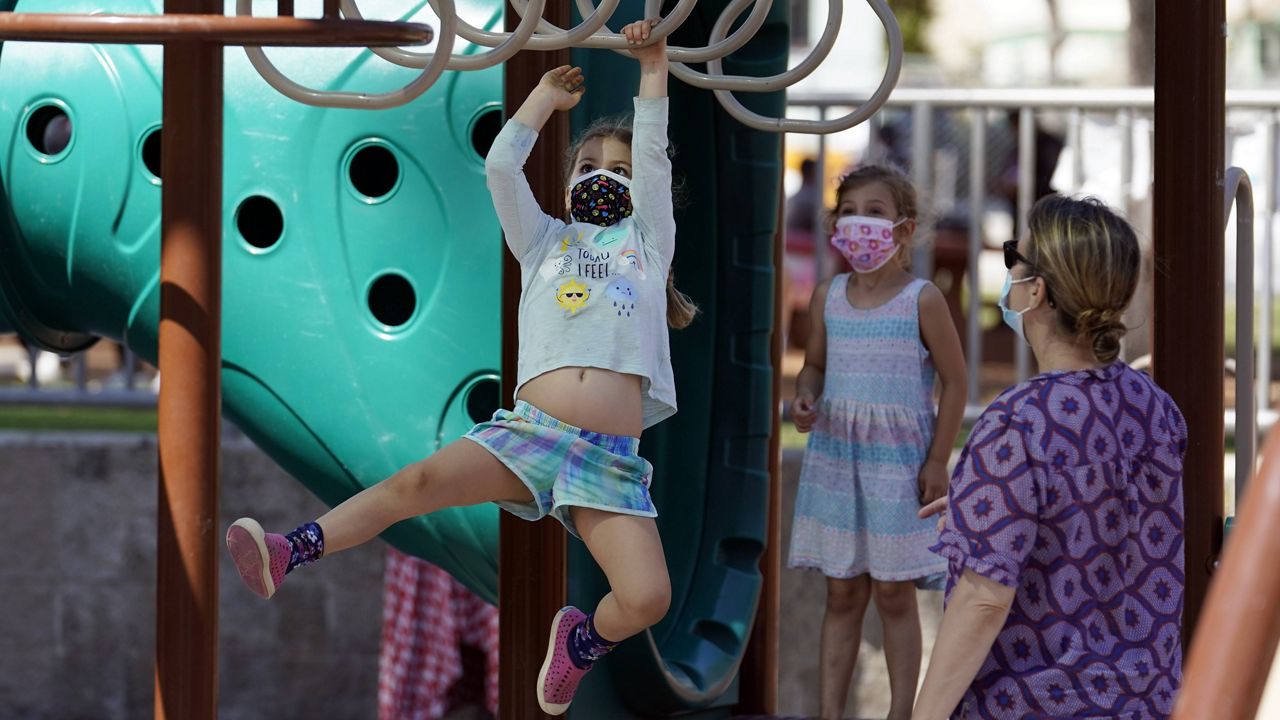 Children play at a playground in Echo Park