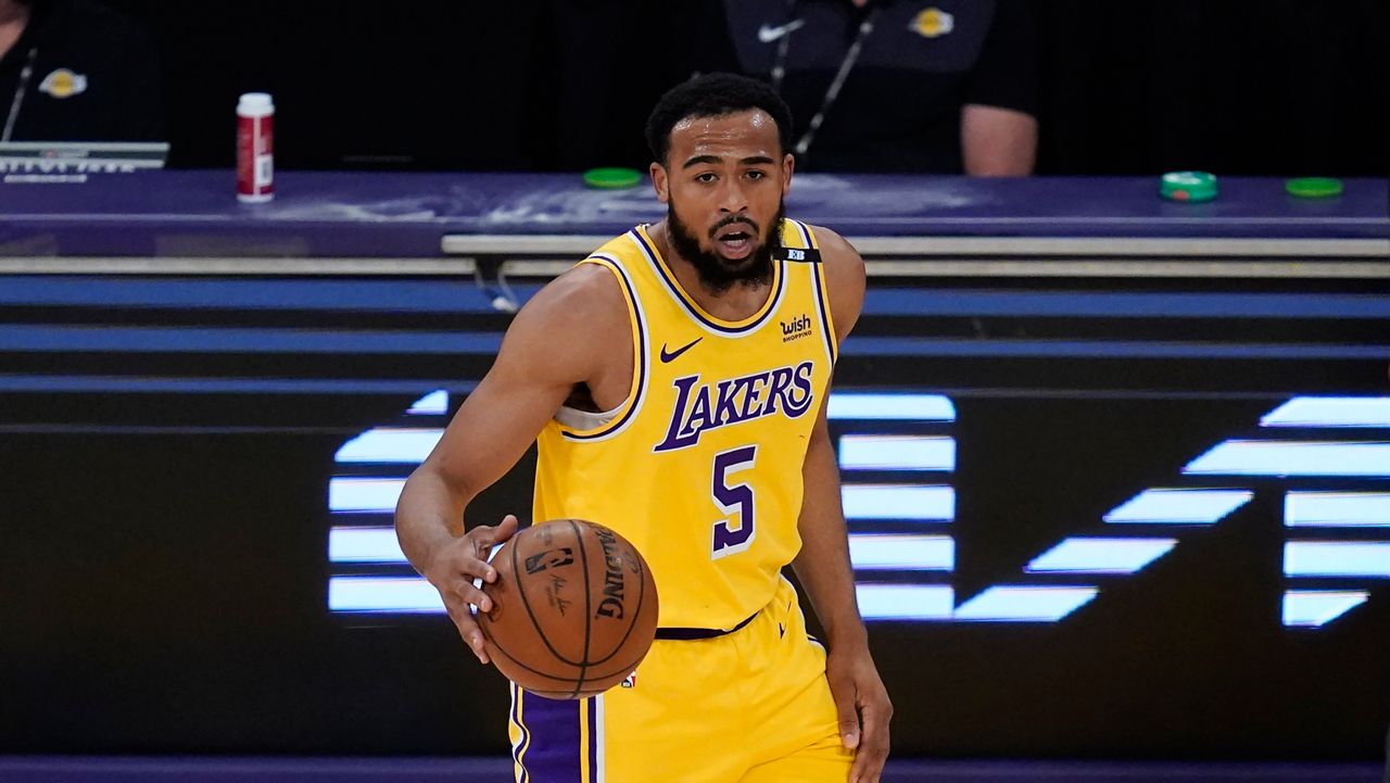 Los Angeles Lakers guard Talen Horton-Tucker (5) controls the ball during Game 6 of an NBA basketball first-round playoff series against the Phoenix Suns Thursday, Jun 3, 2021, in Los Angeles. (AP Photo/Ashley Landis)