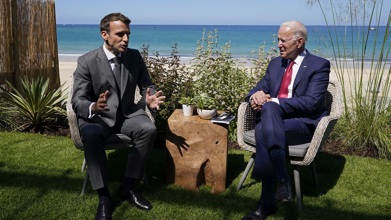 President Joe Biden and French President Emmanuel Macron visit during a bilateral meeting at the G-7 summit, Saturday, June 12, 2021, in Carbis Bay, England. (AP Photo/Patrick Semansky)