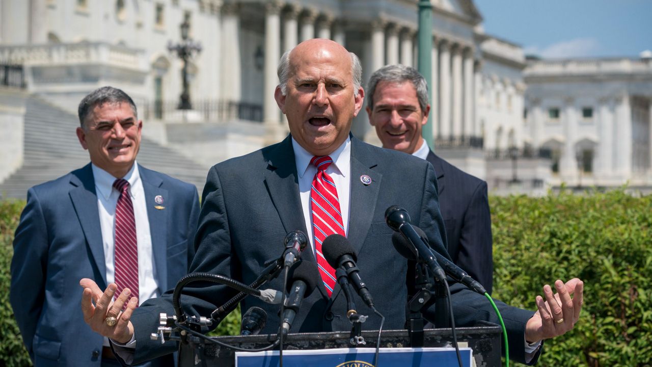 Rep. Louie Gohmert, R-Texas, center, flanked by Rep. Andrew Clyde, R-Ga., left, and their counsel, former Trump administration official Ken Cuccinelli. (AP Photo/J. Scott Applewhite)