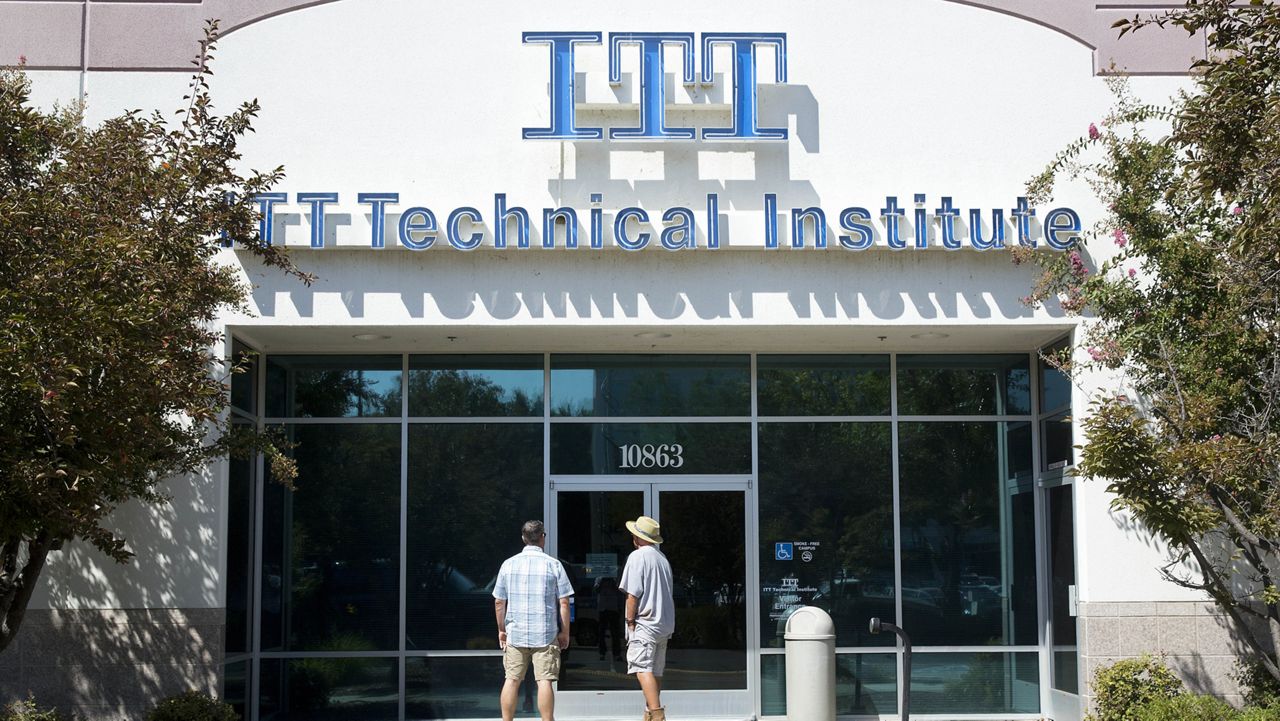 FILE - Students find the doors locked to the ITT Technical Institute campus in Rancho Cordova, Calif. (AP Photo/Rich Pedroncelli, File)