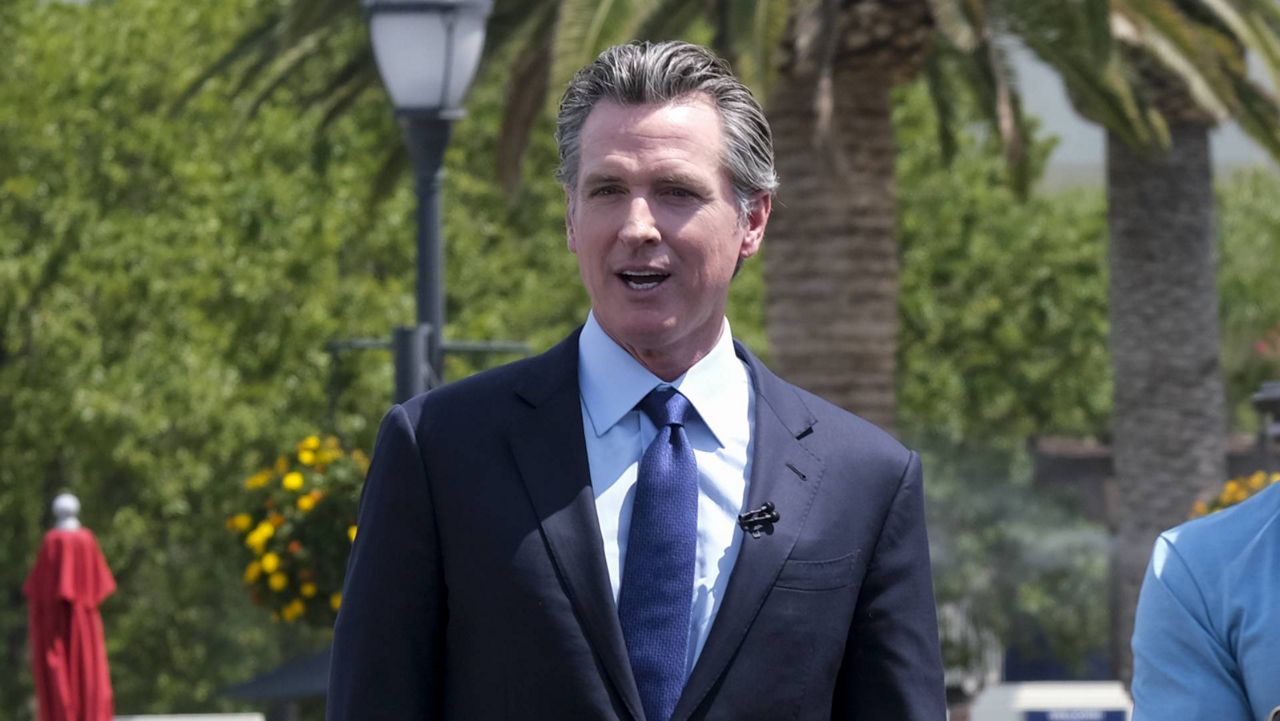 In this June 15, 2021, file photo, California Gov. Gavin Newsom appears during the Vax for the Win lottery contest at Universal Studios in Universal City, Calif. (AP Photo/Ringo H.W. Chiu)