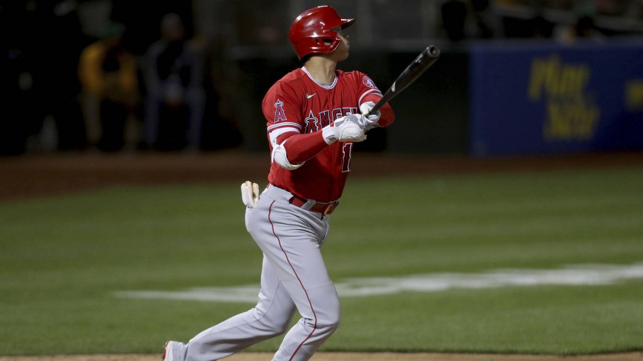 Los Angeles Angels' Shohei Ohtani watches his solo home run against the Oakland Athletics during a baseball game in Oakland, Calif., June 15, 2021. (AP Photo/Jed Jacobsohn)