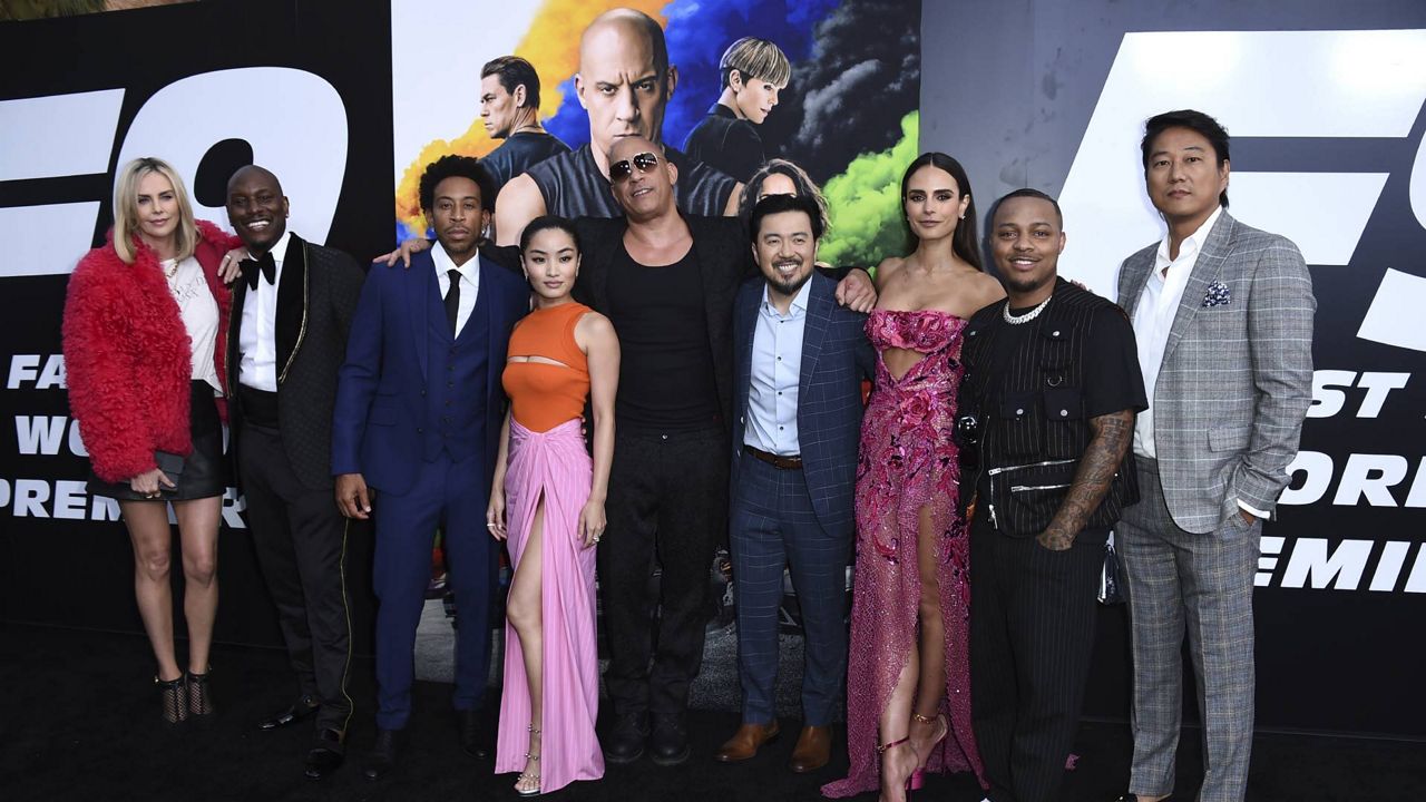 Charlize Theron, Tyrese Gibson, Ludacris, Anna Sawai, Vin Diesel, Justin Lin, Jordana Brewster, Shad Moss, and Sung Kang arrive at the LA premiere of "F9" at the TCL Chinese Theatre on June 18, 2021. (Photo by Jordan Strauss/Invision/AP)