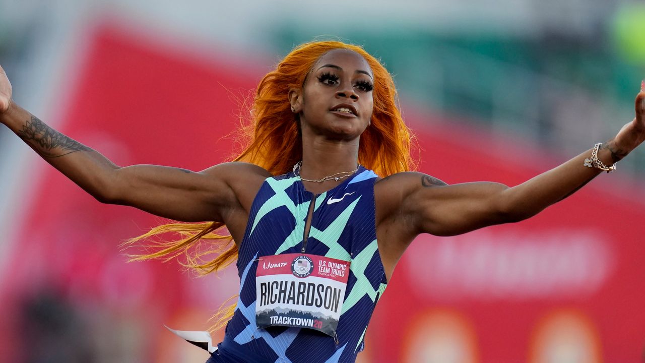 Sha'Carri Richardson celebrates after winning the fourth heat during the women's 100-meter run at the U.S. Olympic Track and Field Trials Friday, June 18, 2021, in Eugene, Ore. (AP Photo/Ashley Landis)