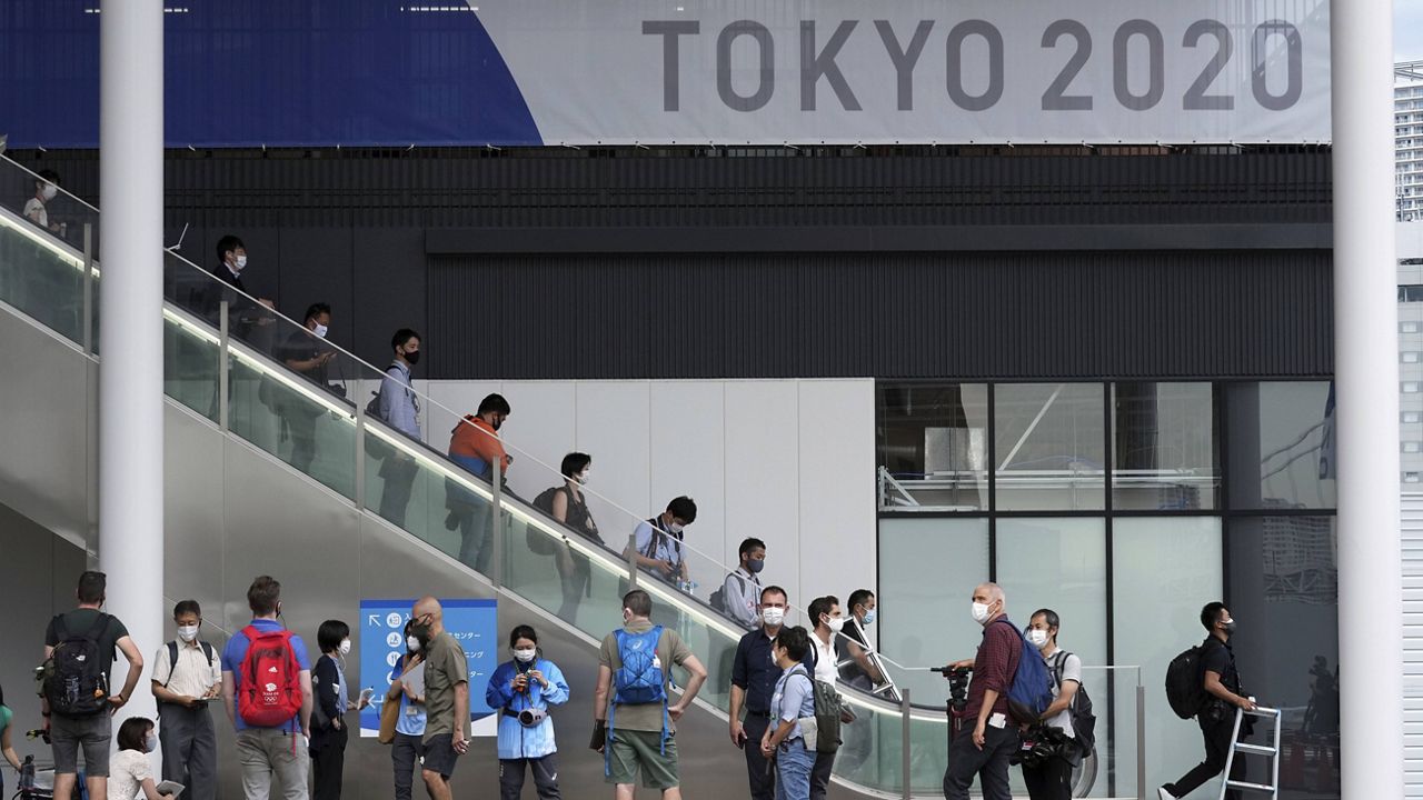 Journalists gather at Multifunctional Complex at the Tokyo 2020 Olympic and Paralympic Village during a media tour Sunday. (AP Photo/Eugene Hoshiko)
