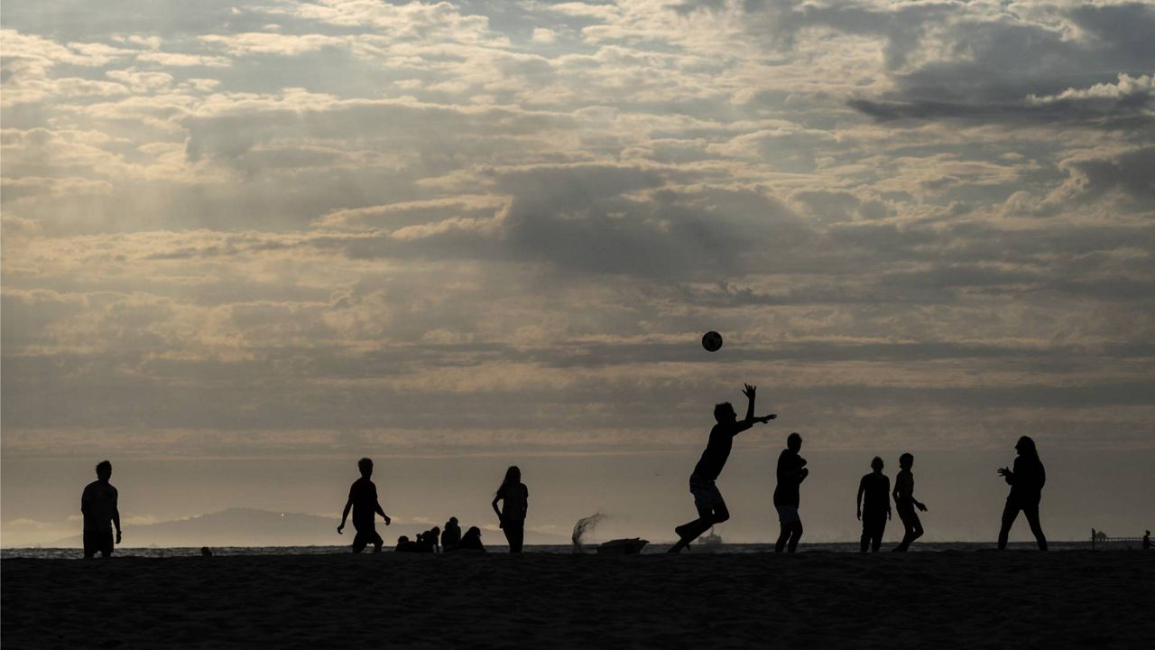 People play soccer on the beach, June 22, 2021, in Newport Beach, Calif. (AP Photo/Jae C. Hong)