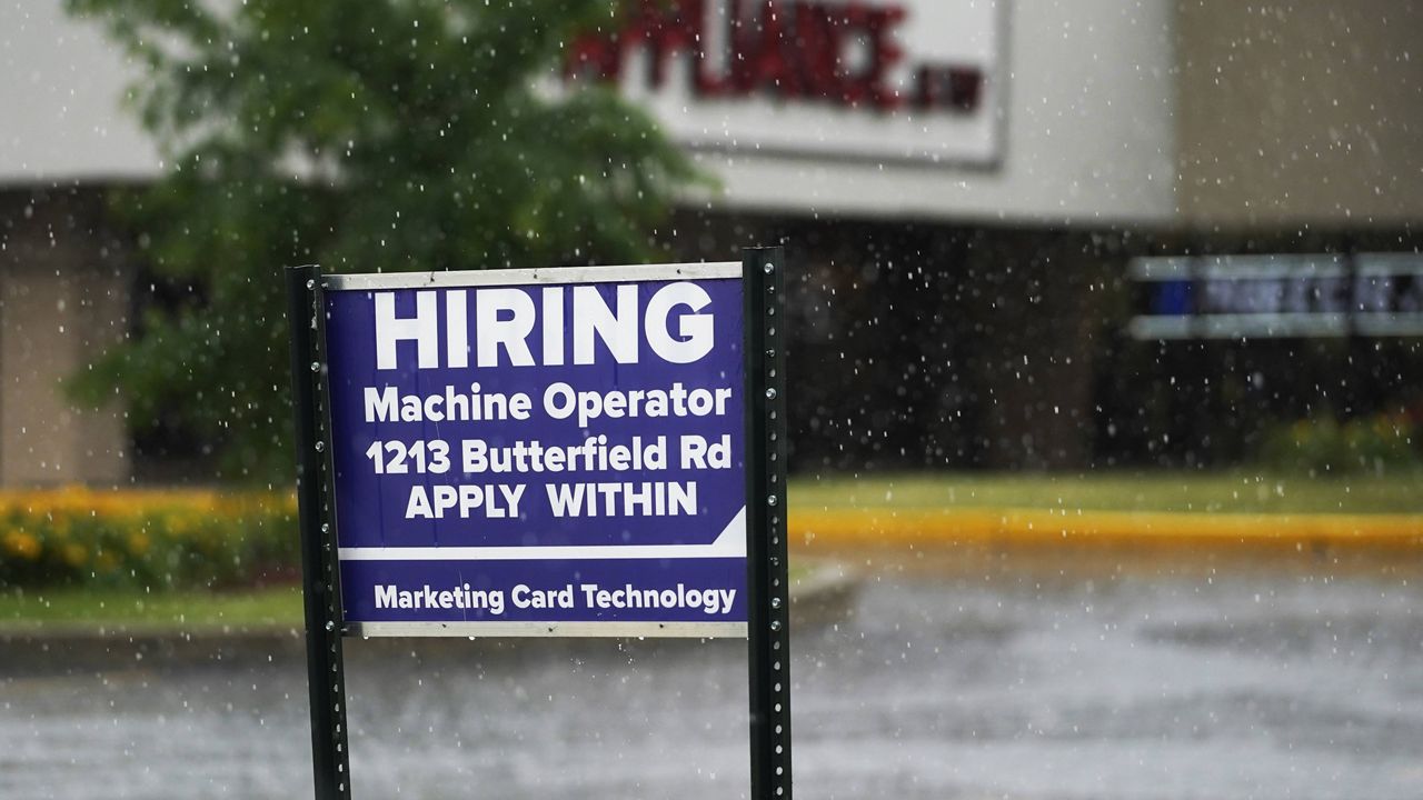A hiring sign is displayed in Downers Grove, Ill., on June 24. (AP Photo/Nam Y. Huh)