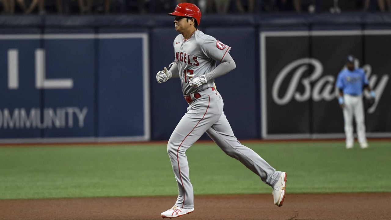 Los Angeles Angels' Shohei Ohtani circles the bases after hitting a solo home run off Tampa Bay Rays opener Andrew Kittredge during a baseball game Friday, June 25, 2021, in St. Petersburg, Fla. (AP Photo/Steve Nesius)