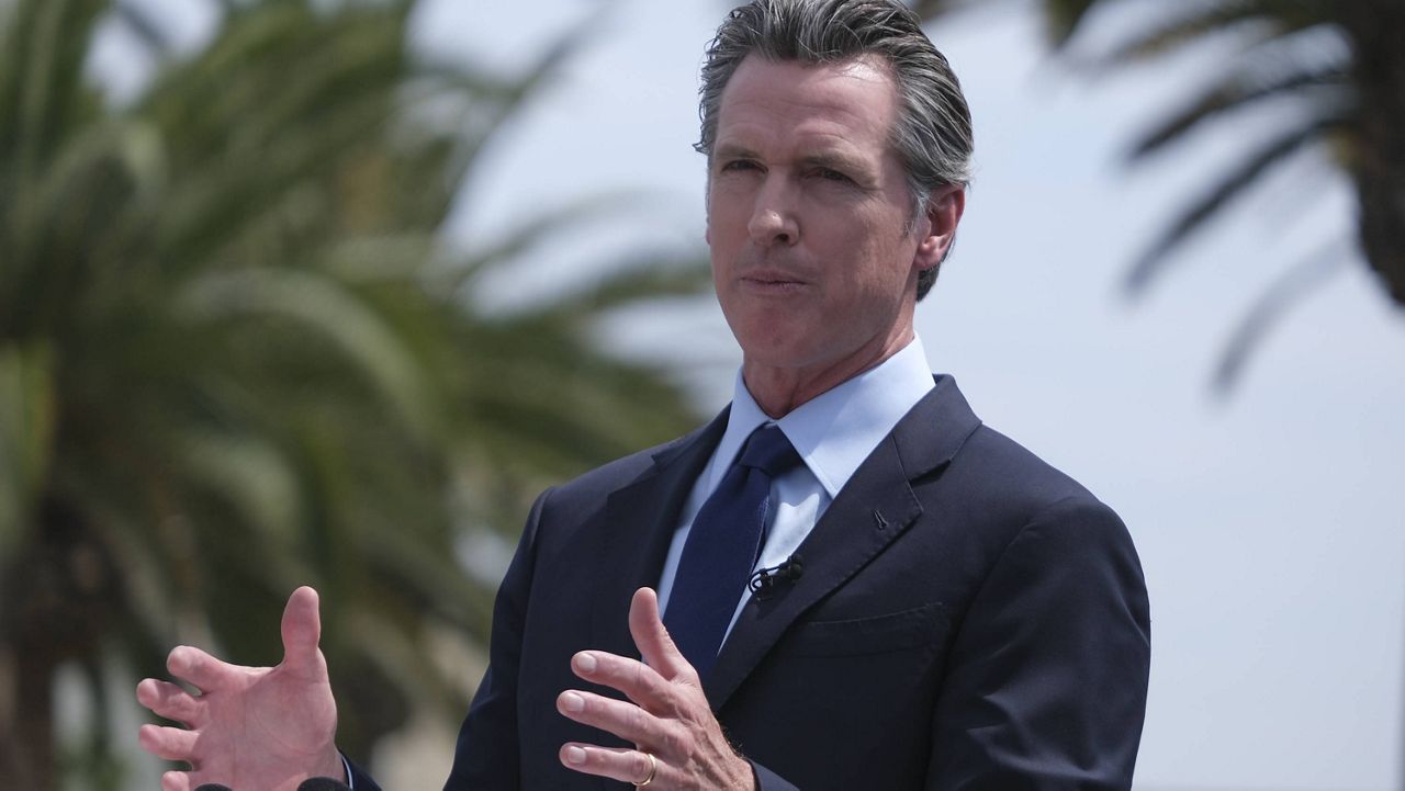 California Governor Gavin Newsom talks during a news conference at Universal Studios in Universal City, Calif., on Tuesday, June 15, 2021. (AP Photo/Ringo H.W. Chiu)