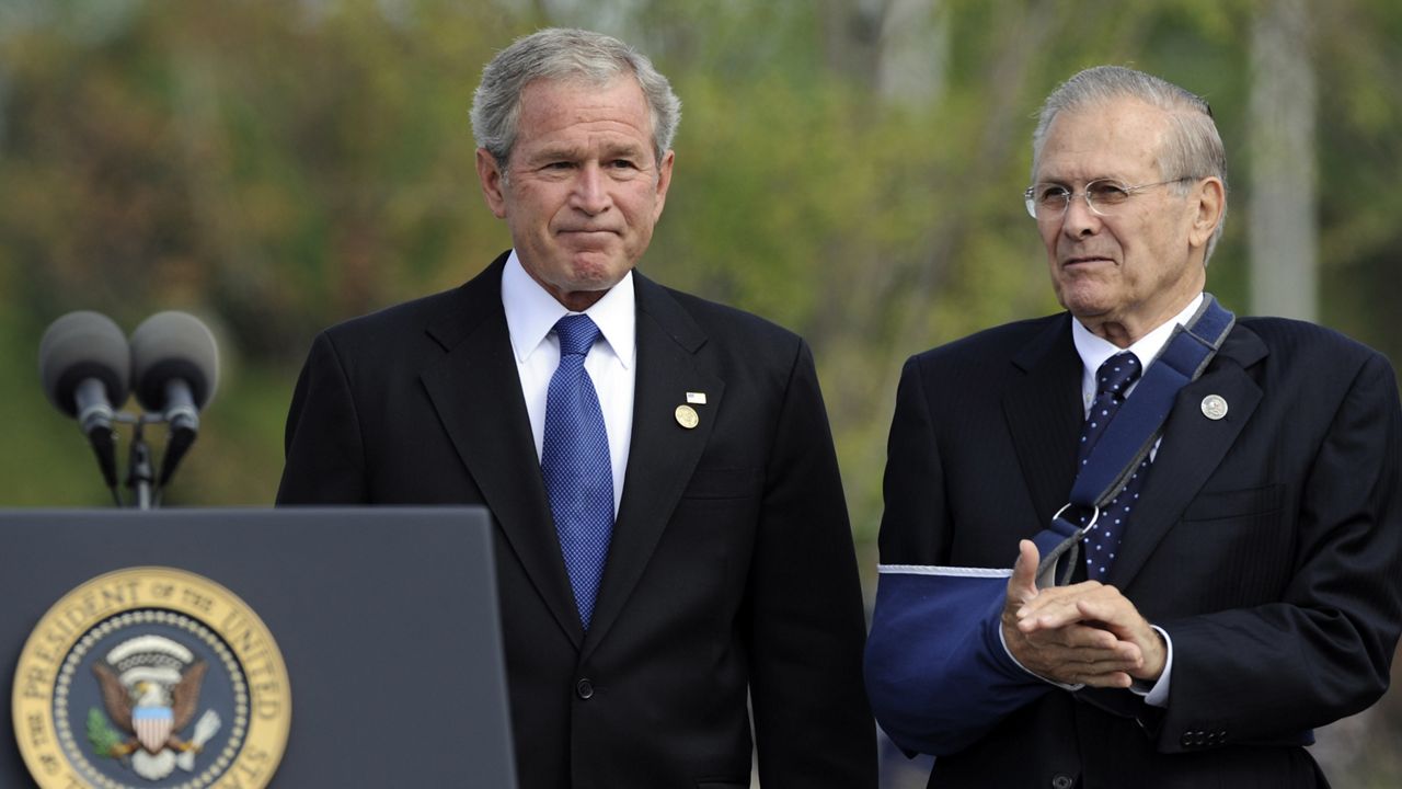 FILE - In this Sept. 11, 2008, file photo, with former Defense Secretary Donald Rumsfeld next to him, President George W. Bush concludes his remarks during a memorial ceremony at the Pentagon, marking the 7th anniversary of the Sept. 11 attacks on the Pentagon and World Trade Center. (AP Photo/Susan Walsh)