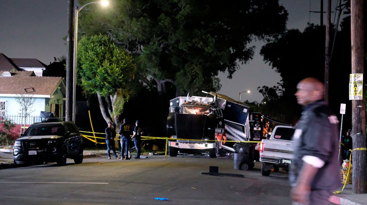 The remains of an armored Los Angeles Police Department tractor-trailer are seen after fireworks exploded Wednesday evening, June 30, 2021. (AP Photo/Ringo H.W. Chiu)