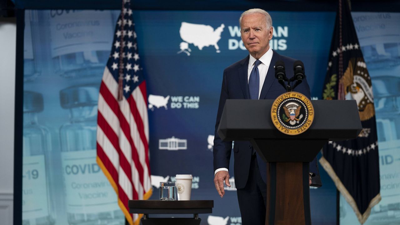 President Joe Biden listens to a question after delivering remarks about the COVID-19 vaccination program in the South Court Auditorium on the White House campus Tuesday in Washington. (AP Photo/Evan Vucci)