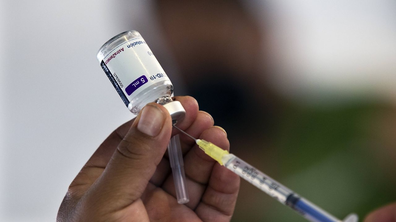 A health worker prepares to administer a jab of the AstraZeneca COVID-19 vaccine during a vaccination drive for people ages 30 to 39 in Mexico City on Wednesday. (AP Photo/Marco Ugarte)