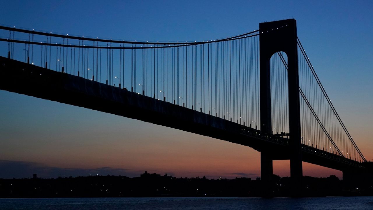 The Verrazzano-Narrows Bridge is seen at dawn in New York, Wednesday, June 30, 2021. (AP Photo/Seth Wenig)