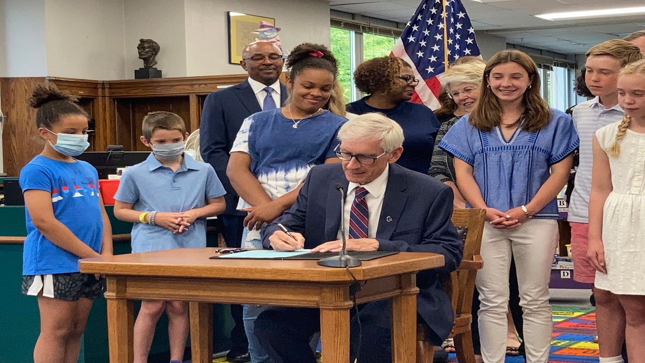 Evers signs GOP-written state budget with $2B tax cut