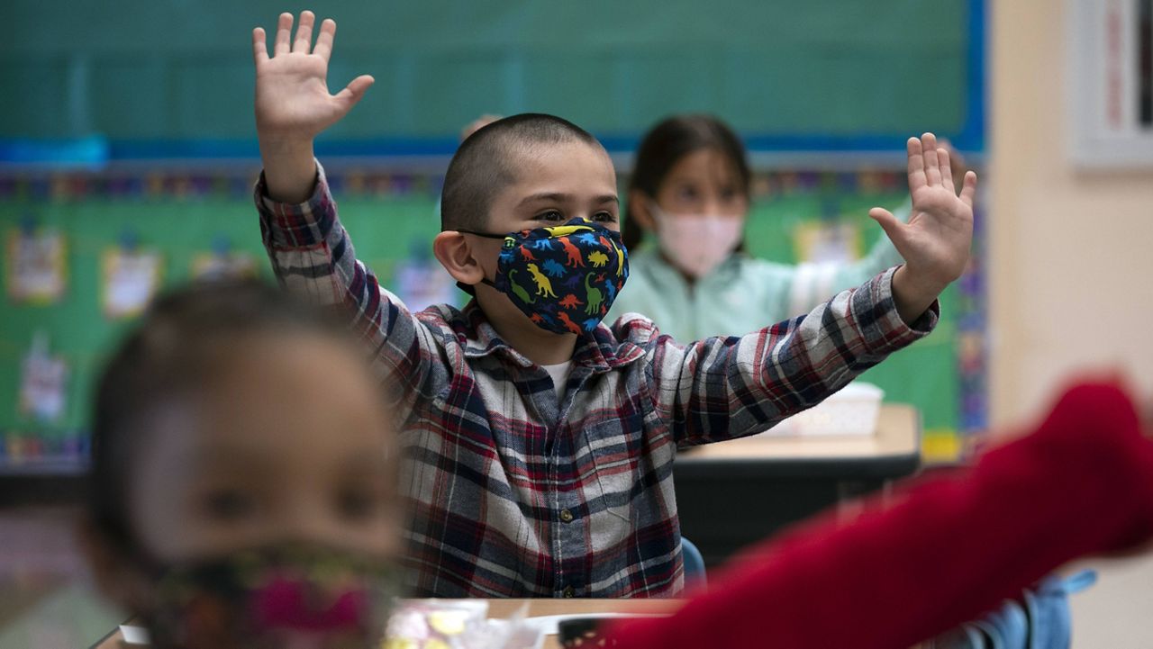 In this April 13, 2021, file photo, kindergarten students participate in a classroom activity on the first day of in-person learning at Maurice Sendak Elementary School in Los Angeles.(AP Photo/Jae C. Hong)