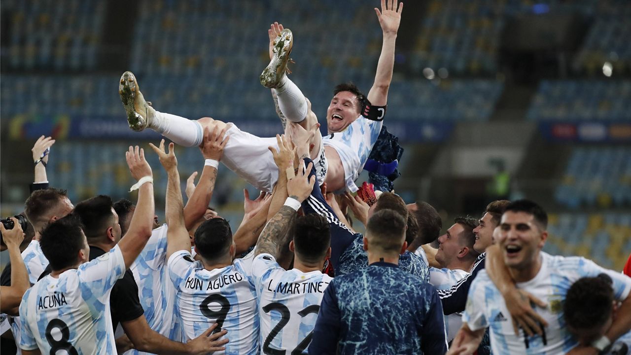 Teammates lift Argentina's Lionel Messi after beating Brazil 1-0 during the Copa America final soccer match at the Maracana stadium in Rio de Janeiro, Brazil, Saturday, July 10, 2021. (AP Photo/Bruna Prado)