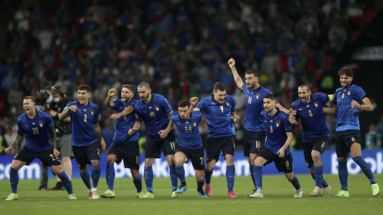 Italy players react during a penalty shootout after extra time during of the Euro 2020 soccer championship final match between England and Italy at Wembley stadium in London, Sunday, July 11, 2021. (Carl Recine/Pool Photo via AP)