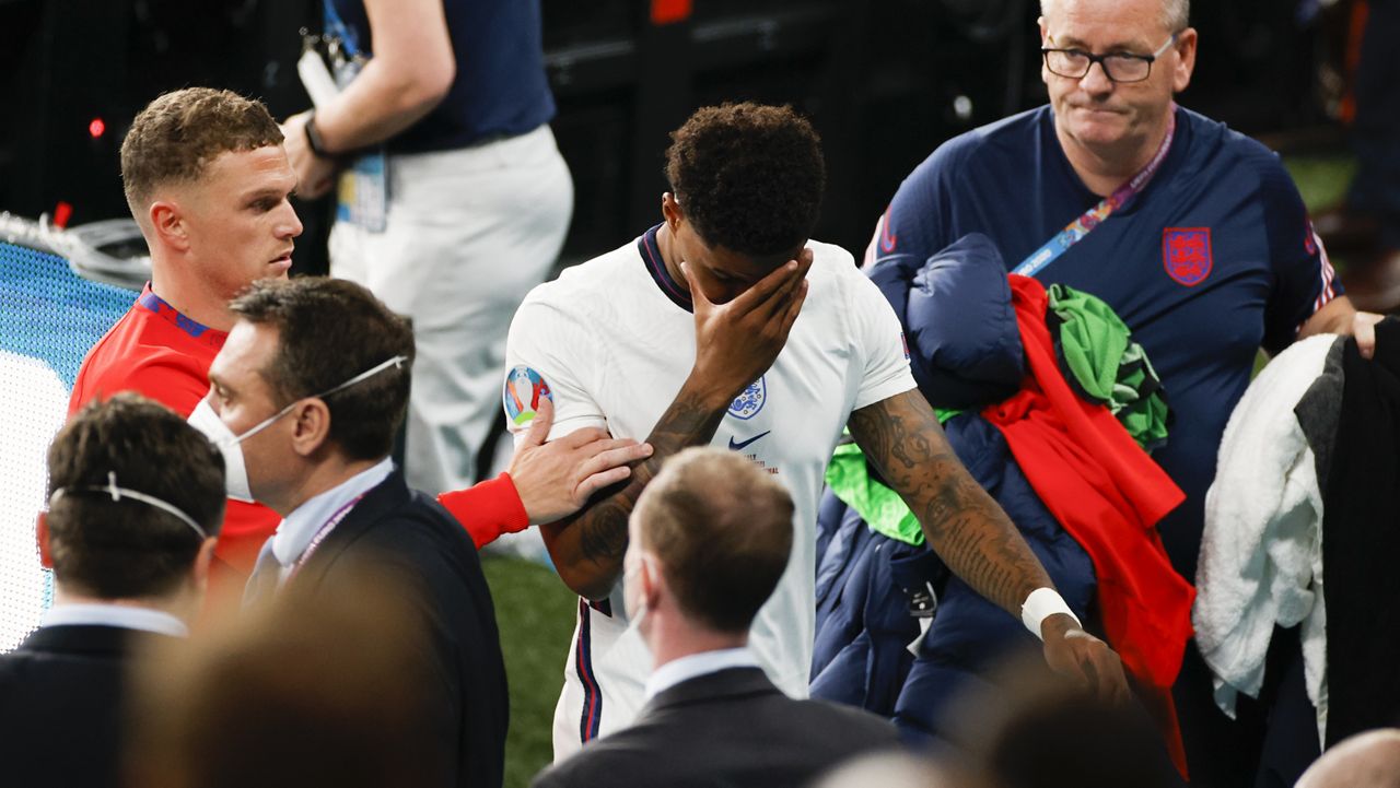 England's Marcus Rashford walks from the field after a penalty shootout at the Euro 2020 soccer championship final between England and Italy at Wembley stadium in London, Sunday, July 11, 2021. (John Sibley/Pool Photo via AP)