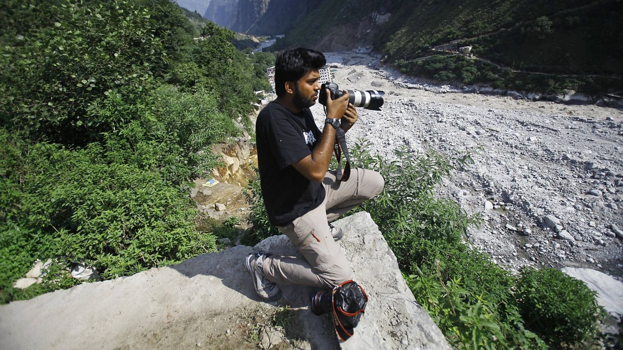 In this 2013 file photo, Reuters photographer Danish Siddiqui covers the monsoon floods and landslides in the upper reaches of Govindghat, India. (AP Photo/Rafiq Maqbool)