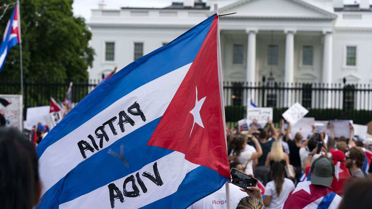 Demonstrators shout their solidarity with the Cuban people against the communist government during a rally outside the White House in Washington, Saturday, July 17, 2021. (AP Photo/Jose Luis Magana)