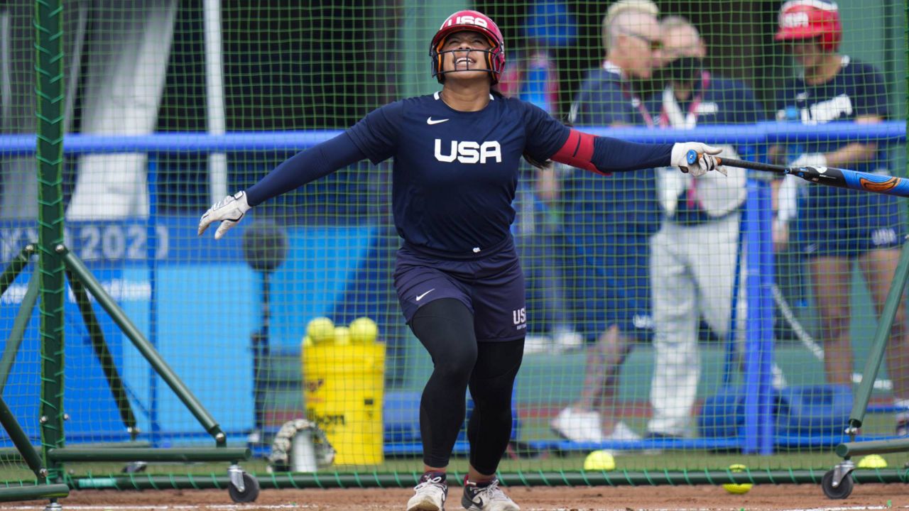 U.S. softball player Dejah Mulipola takes batting practice during a training session at the Fukushima Azuma Baseball Stadium, Tuesday, July 20, 2021, in Fukushima, Japan. (AP Photo/Jae C. Hong)