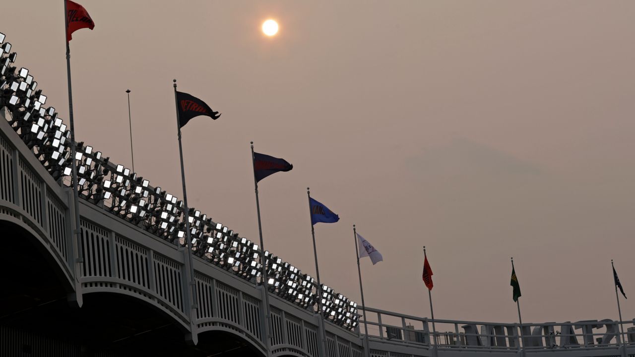 Smoke from western wildfires made the sky over Yankee Stadium hazy on Tuesday, July 20, 2021. (AP Photo/Adam Hunger)