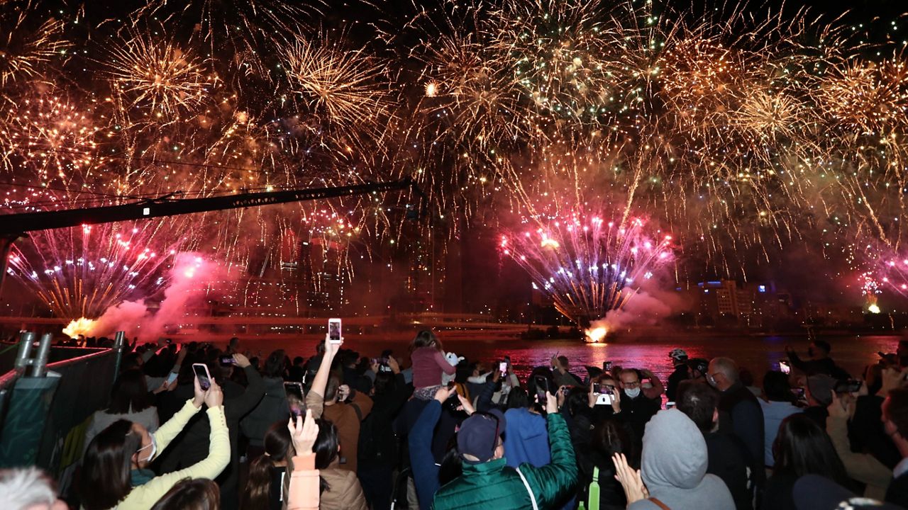 People celebrate in Brisbane, Australia, on Wednesday following an announcement by the International Olympic Committee that Brisbane was picked to host the 2032 Olympics. (Jason O'Brien/AAP Image via AP)