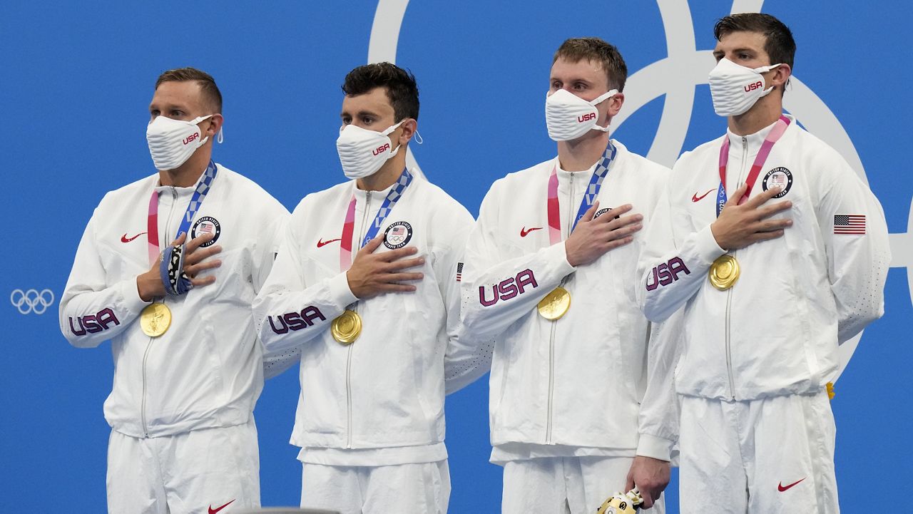 United States men's 4x100m freestyle relay team of Caeleb Dressel, from left, Blake Pieroni, Bowen Becker, Zach Apple poses after winning the gold medal at the 2020 Summer Olympics, Monday, July 26, 2021, in Tokyo, Japan. (AP Photo/Petr David Josek)