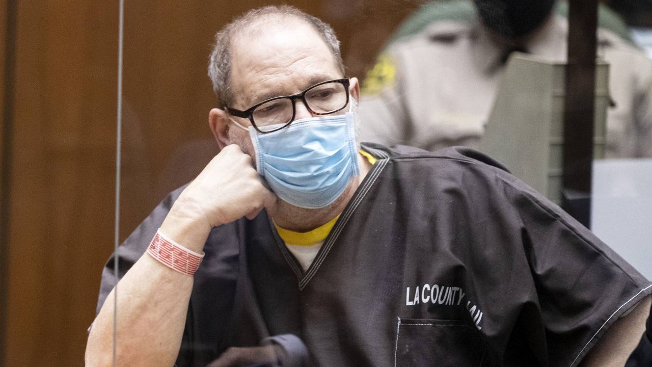 Harvey Weinstein wears a face mask behind a protective plexiglass screen as he listens in court during a pre-trial hearing in Los Angeles, July 29, 2021. (Etienne Laurent/Pool Photo via AP)