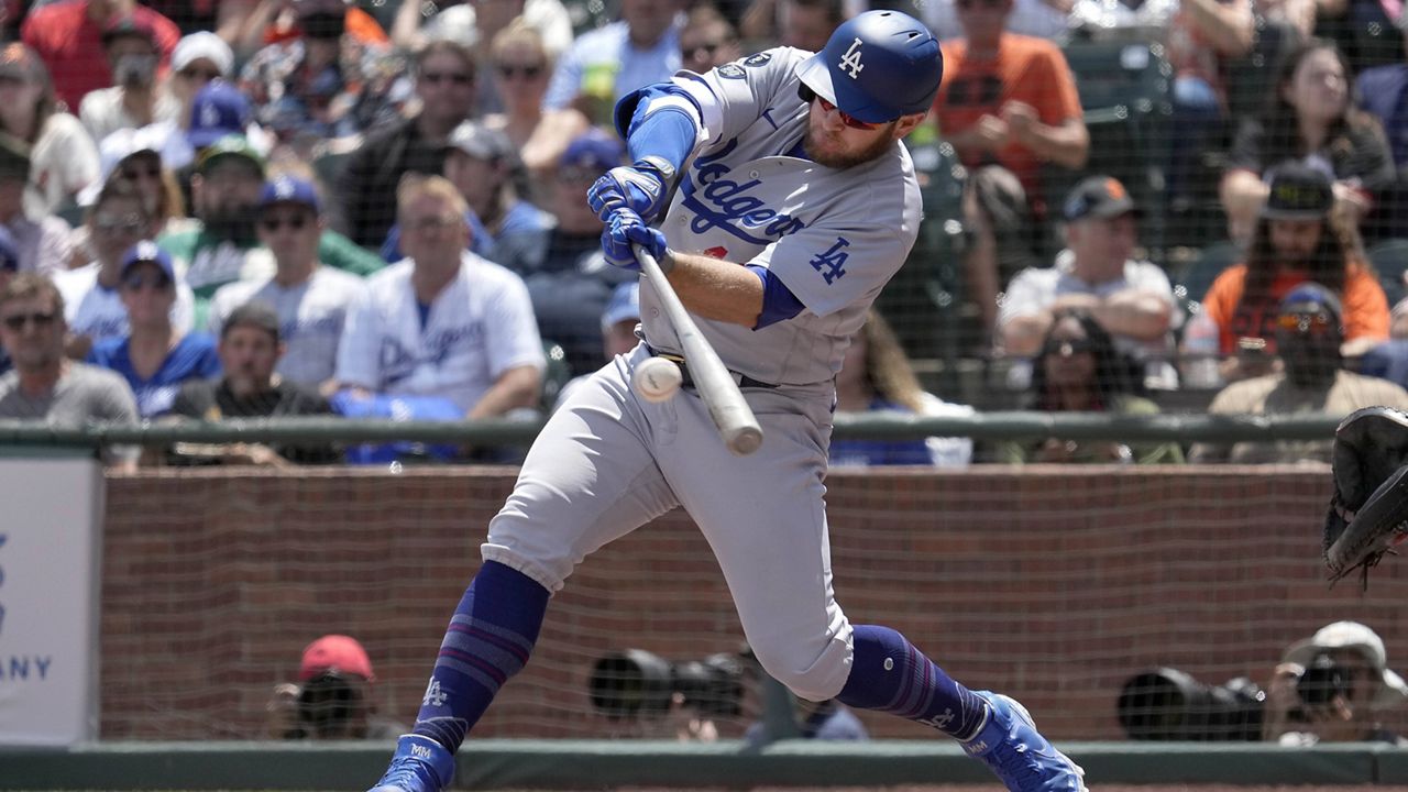 Los Angeles Dodgers' Max Muncy hits a single against the Los Angeles Dodgers during the sixth inning of a baseball game Thursday, July 29, 2021, in San Francisco. (AP Photo/Tony Avelar)