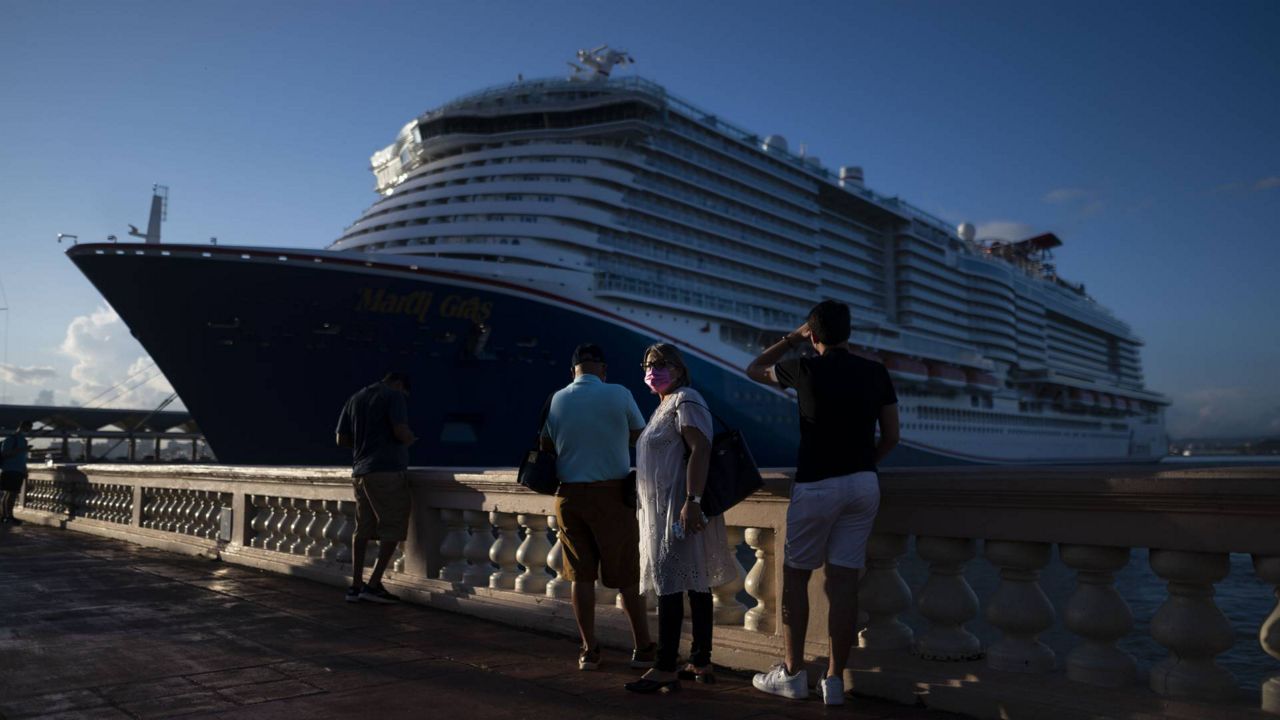 Carnival's Mardi Gras cruise ship is docked in the bay of San Juan, Puerto Rico, Aug. 3, 2021, marking the first time a cruise ship visits the U.S. territory since the COVID-19 pandemic began. (AP Photo/Carlos Giusti)