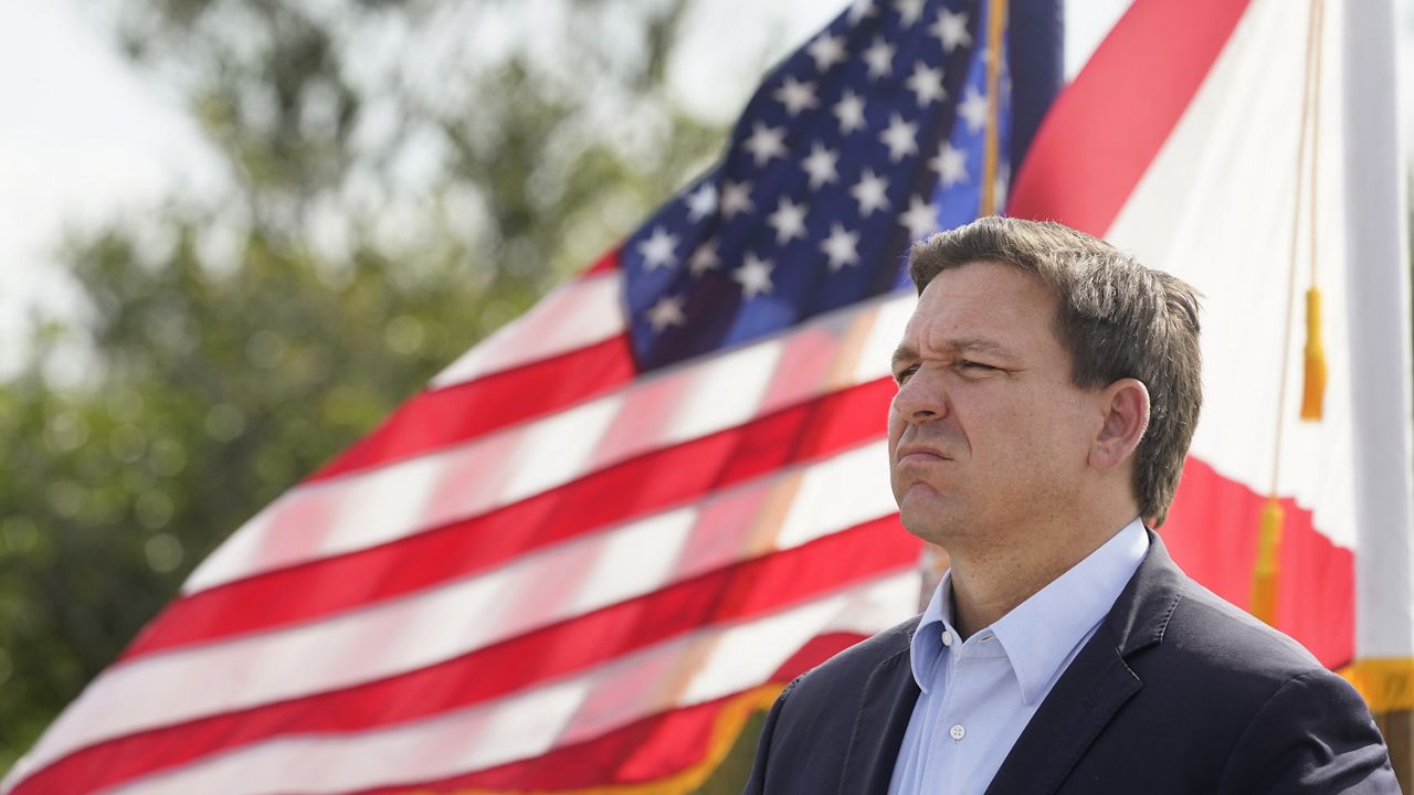 Florida Gov. Ron DeSantis listens during a news conference, Tuesday, Aug. 3, 2021, near the Shark Valley Visitor Center in Miami. (AP Photo/Wilfredo Lee)