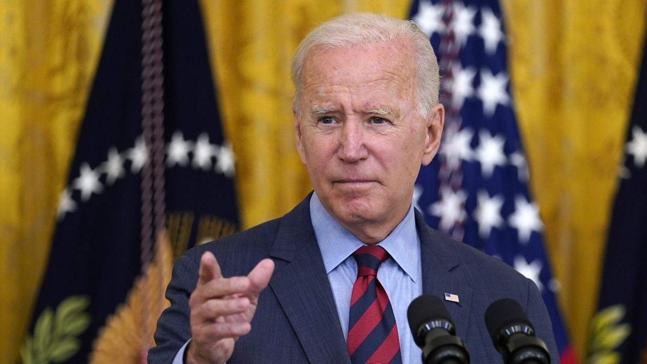 President Joe Biden gestures to a reporter to ask him a question as he speaks about the coronavirus pandemic in the East Room of the White House in Washington, Tuesday, Aug. 3, 2021. (AP Photo/Susan Walsh)