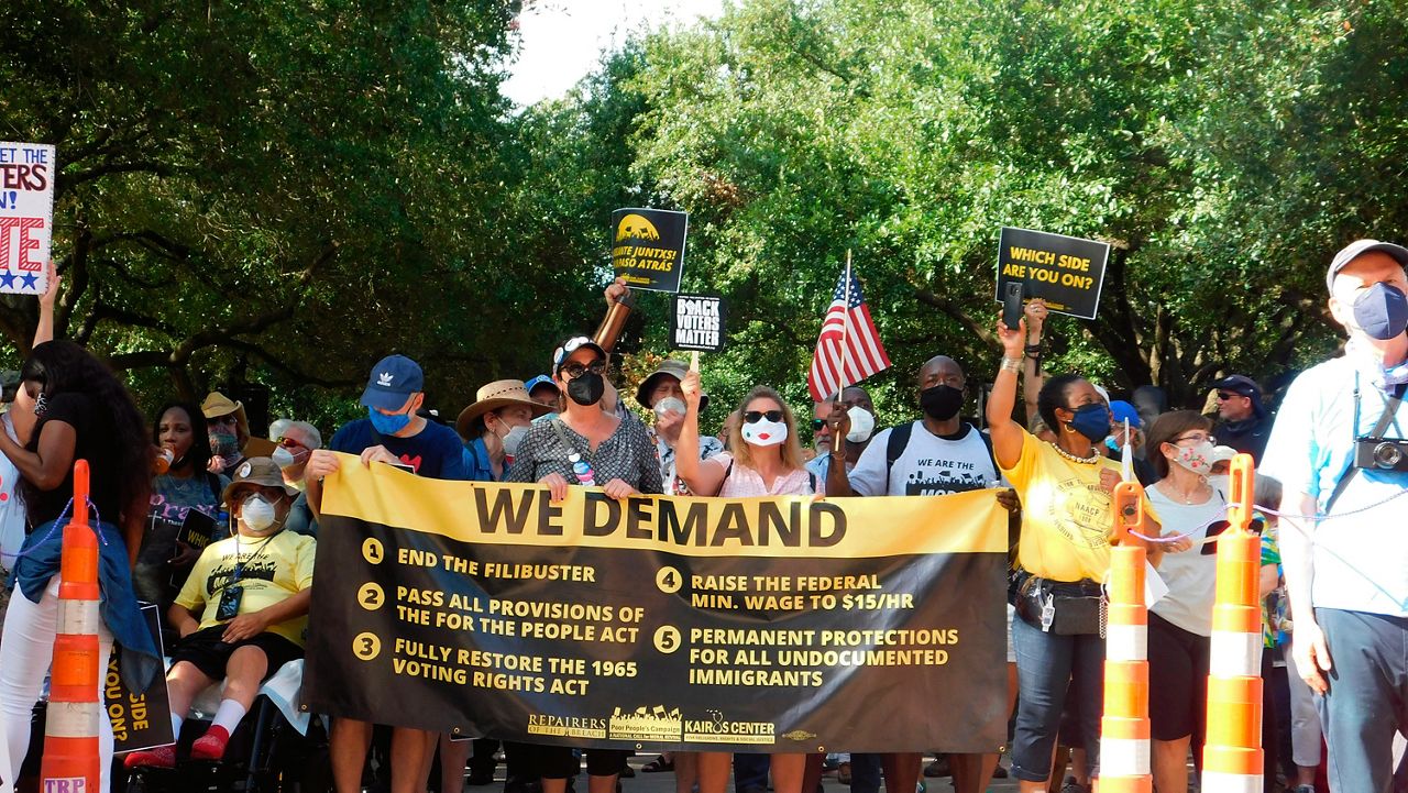 FILE - In this July 31, 2021 file photo, protesters march for voting rights at the Texas Capitol in Austin, Texas.(AP Photo/Acacia Coronado File)