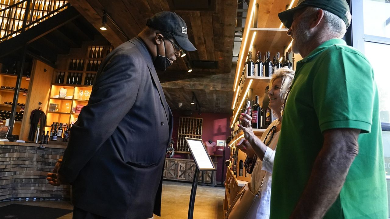 FILE - Security personnel ask customers for proof of vaccination as they enter City Winery, Thursday, June 24, 2021, in New York. (AP Photo/Frank Franklin II, File)