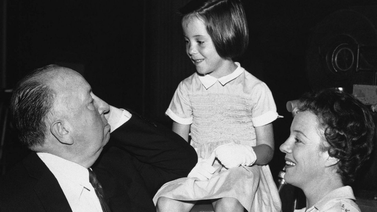 British director and producer Alfred Hitchcock appears with his eldest granddaughter, six-year old Mary O'Connell, and her mother, actress Pat Hitchcock, right. (AP Photo)