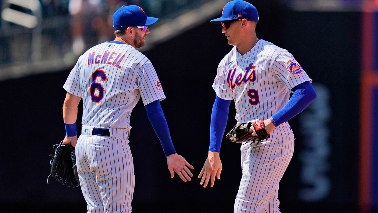 New York Mets' Jeff McNeil, left, and Brandon Nimmo celebrate after a baseball game against the Washington Nationals at Citi Field, Thursday, Aug. 12, 2021, in New York. The Mets defeated the Nationals 4-1. (AP Photo/Seth Wenig)
